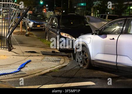 NYPD officers work the scene where a 31-year-old woman is in critical condition after she was struck by a 39-year-old man driving a 2003 Gray Fisker at Park Avenue and Nostrand Avenue within the confines of the 79 precinct in Brooklyn, New York, United States on Sunday, August 2, 2026. Sunday evening at approximately 9:11 pm, police responded and upon arrival it was determined that a 39-year-old man operating a 2003 Gray Fisker was traveling westbound on Park Avenue and attempting to turn onto Nostrand Avenue when he collided with a grey Honda minivan. The 2003 Gray Fisker then jumped the curb Stock Photo