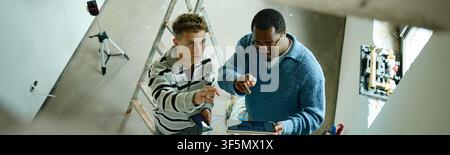 Black Man and Man Planning House Renovation with Digital Tablet Stock Photo