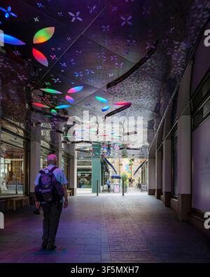 London - 07 21 2022: Slingsby Place reflective illuminated ceiling with modern walkway. Covered pedestrian walkway with reflective ceiling displaying Stock Photo