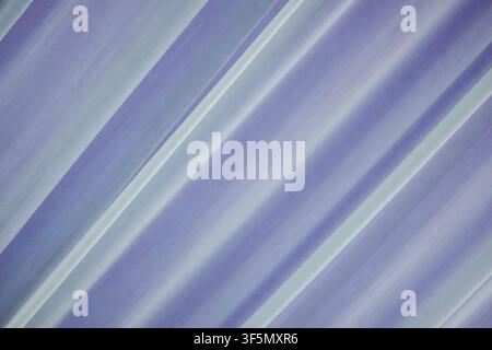 Close-up view of soft diagonal folds in purple and white textile material. High-quality background for weddings, events, and interior design concepts. Stock Photo