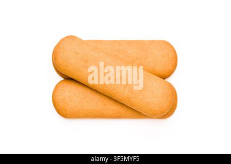 Three overlapping golden biscuits isolated on a white studio background Stock Photo