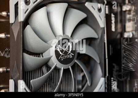 Urdorf, Switzerland, July 29,2026. Detailed view of a Scythe CPU cooling fan attached to a heatsink next to RAM memory modules inside a modern desktop Stock Photo