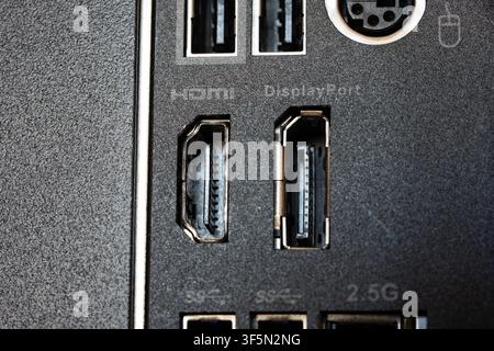Extreme close up macro shot of the HDMI and DisplayPort output connectors on the rear IO panel of a PC motherboard, showing intricate mechanical detai Stock Photo