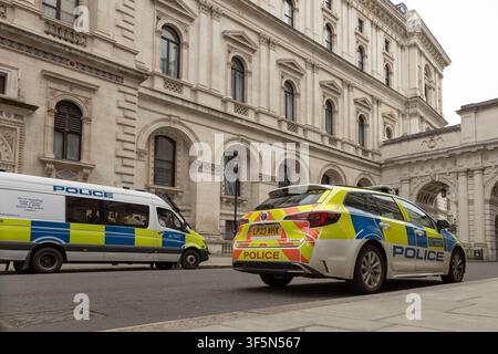 British police vehicle parked outside London government building. London, UK, 16 March 2024 Stock Photo
