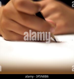 7-year old first grader doing his homework. Stock Photo