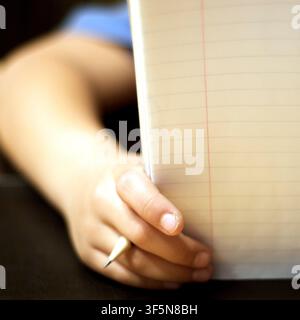 7-year old first grader doing his homework. Stock Photo