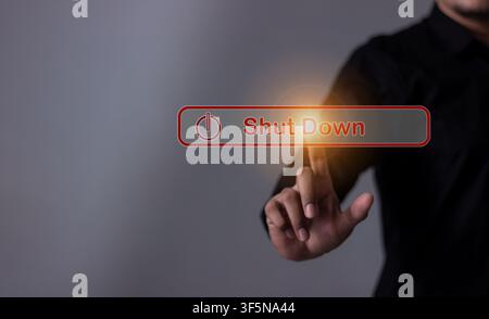 Young man hand touching Shut Down button press power OFF Stock Photo