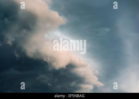 Dramatic storm clouds fill a moody sky Stock Photo