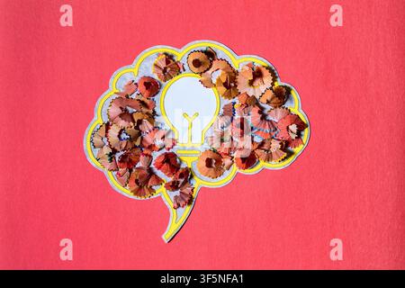 Conceptual illustration of an idea being born, featuring a lightbulb and pencil shavings within a brain shaped bubble. Stock Photo