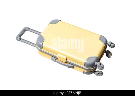 Small yellow toy luggage with wheels and handle on a white background Stock Photo