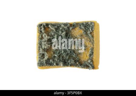 Heavily used yellow kitchen sponge with a worn green scouring pad, viewed from above isolated on a white background. Ideal for cleaning, hygiene, hous Stock Photo