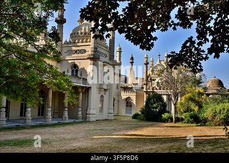 Brighton Pavilion, Brighton, East Sussex, England, viewed from the surrounding gardens, showing its distinctive domes, minarets and Indo-Saracenic arc Stock Photo