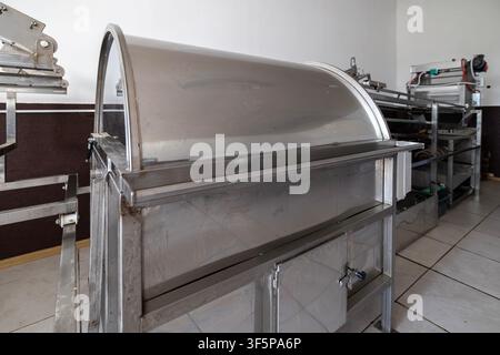 Stainless steel honey extraction equipment in a workshop professional processing machinery and specialized metal tools for beekeeping operations, show Stock Photo