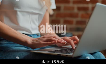 Unrecognizable Caucasian business woman typing laptop close up female hands chatting with computer keyboard unknown businesswoman working online with Stock Photo