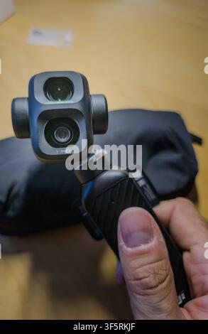 Barcelona, Spain. August 03, 2026, Person holding DJI Osmo Pocket 4P or 4 pro gimbal camera Stock Photo