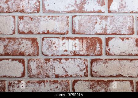 Whitewashed brick wall texture with rustic red masonry background. Stock Photo
