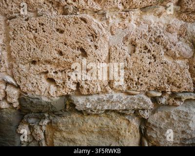 Rough Natural Stone Wall Texture with Large Irregular Blocks Stock Photo