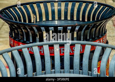 The tops of trash cans on the sidewalk Stock Photo