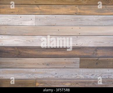 Horizontal reclaimed wood plank wall with natural grain and weathered finish Stock Photo