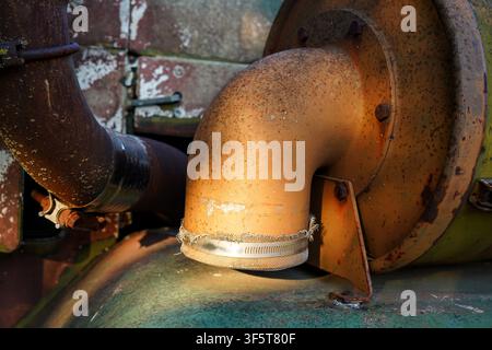 Intake on vintage military truck with faded paint,rust and lichen. Stock Photo