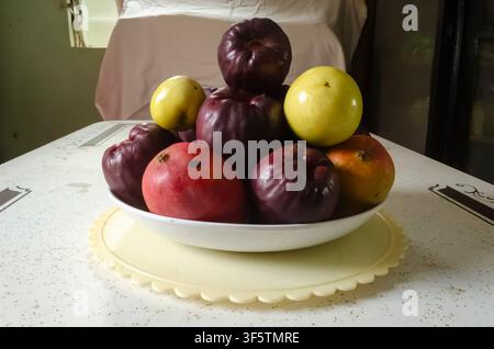 Otaheite, Mango and Passion Fruits Stacked In A Plate Stock Photo