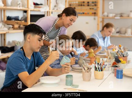 Boy at a master class for children on ceramics Stock Photo