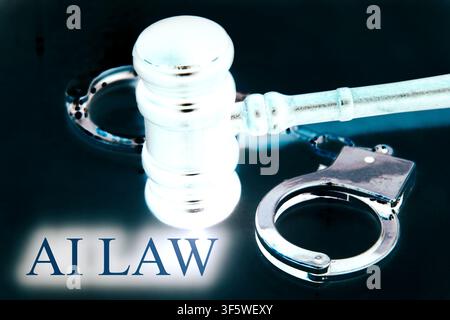 Close-up conceptual image of a judge's gavel with metallic handcuffs wrapped around the hammer, featuring the words "AI LAW". The composition represen Stock Photo