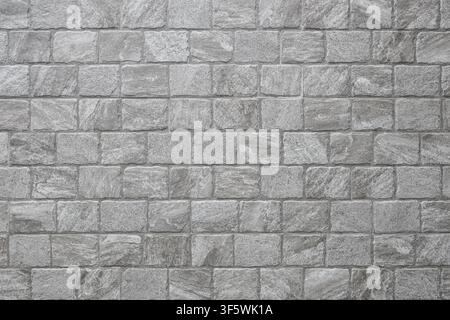 gray and white stone brick wall for pattern and background. Stock Photo