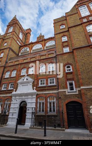Historic building entrance featuring white double doors, fluted columns ...