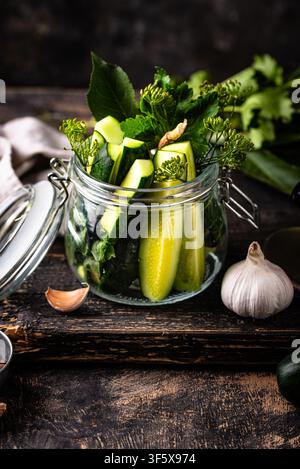 Preparation of marinated salty pickled cucumbers Stock Photo