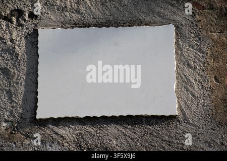 empty marble plaque hanging on the concrete wall Stock Photo