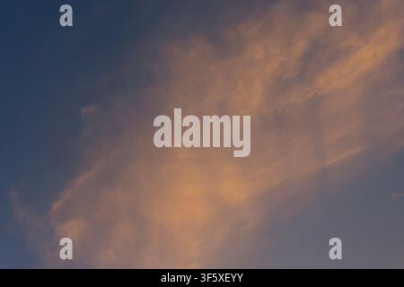 Soft Orange Sunset Clouds in Evening Sky Stock Photo