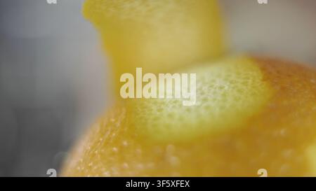 Citrus zest texture macro detail. Peeling orange skin, fresh fruit ingredient for cooking and baking Stock Photo