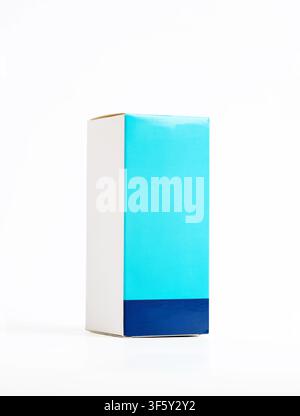 Closed light blue and white cardboard box packaging standing on white background, ideal for pharmaceuticals, cosmetics or other products Stock Photo