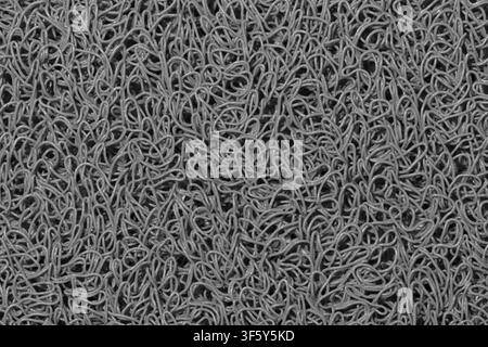 Gray background wavy fibers plastic string material texture black and white. Stock Photo