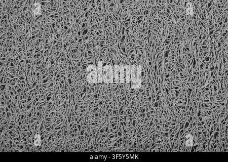 Gray background wavy fibers plastic string material texture black and white. Stock Photo