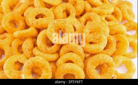 Puffed corn ring chips with salt and oregano Stock Photo