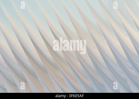 An elegant abstract composition showcasing soft, light blue and white diagonal curves that mimic the appearance of silk or light waves. Stock Photo