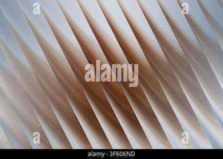 An abstract digital art background featuring a series of repeating diagonal, soft, curved wave patterns in shades of cool blue and warm beige. Stock Photo
