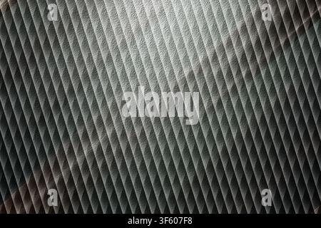 A high-resolution abstract background featuring a repeating diagonal pattern with a metallic, textured surface in shades of silver, grey, and charcoal Stock Photo
