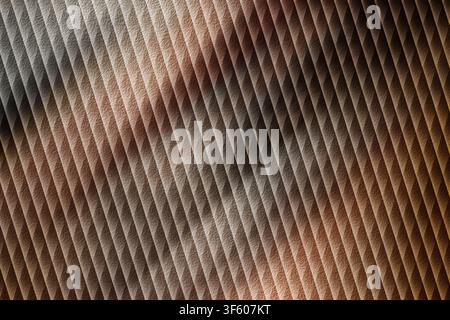 An abstract background featuring a repeating diagonal stripe pattern with a textured finish, rendered in warm brown and copper earth tones. Stock Photo