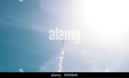 Aerobatic Biplane Trailing a White Smoke Spiral Against a Clear Blue Sky at an Air Show — Precision Flying, Freedom and Adventure Concept Stock Photo