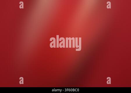 A vibrant red background featuring a subtle, grainy texture and a soft diagonal light gradient, creating a smooth and elegant visual effect. Stock Photo
