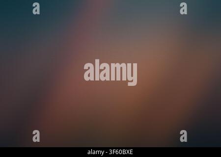 A high-quality abstract background featuring a subtle, grainy texture with a smooth, atmospheric gradient transitioning from deep blue to warm copper. Stock Photo