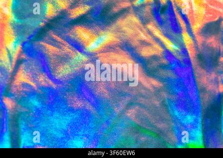 Holographic iridescent foil texture with rainbow abstract light and metallic shimmer for backgrounds Stock Photo
