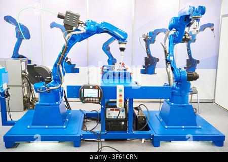 Six-axis welding robots for industry and metal part Stock Photo