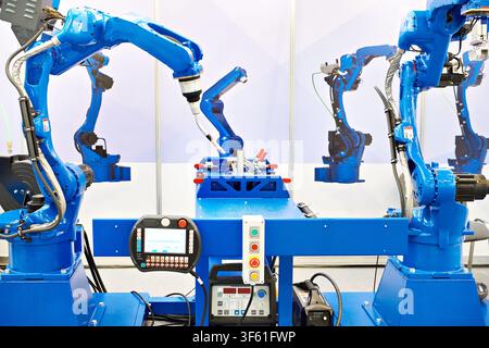 Six-axis welding robots for industry and metal part Stock Photo