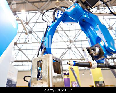 Welding robotic arm manipulator for industry and metal part Stock Photo