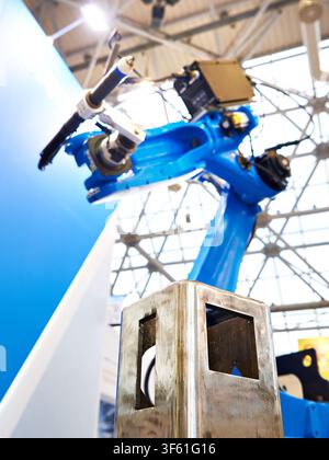 Welding robotic arm manipulator for industry and metal part Stock Photo