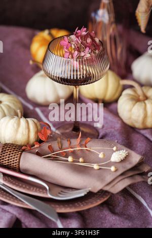 Elegant autumn table setting with pumpkins and vintage glass Stock Photo